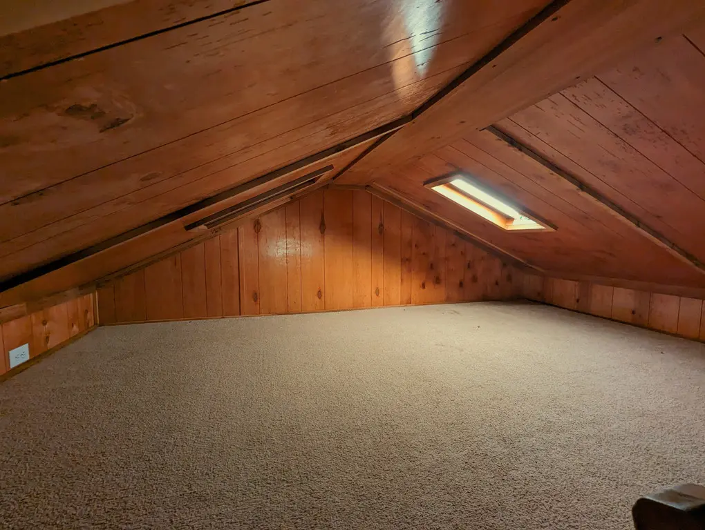 A carpeted loft in a camping cabin